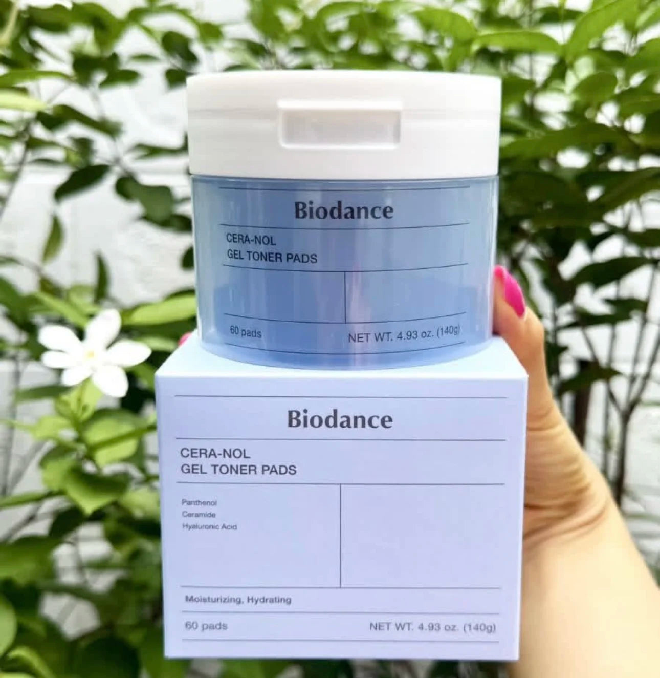 Biodance Cera-Nol Gel Toner Pads packaging held in front of a green leafy background