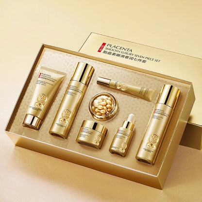 Placenta skincare set with various bottles and containers in a gold box on a beige background
