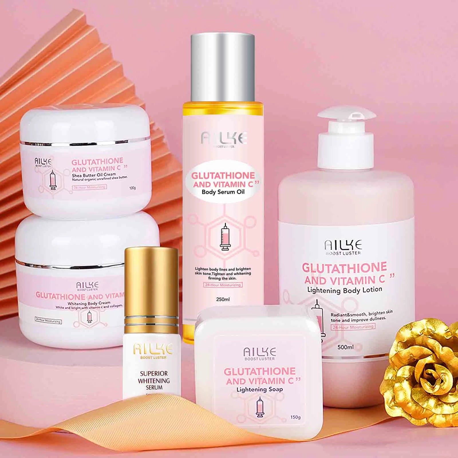Set of Allye skincare products on a pink background with decorative elements.